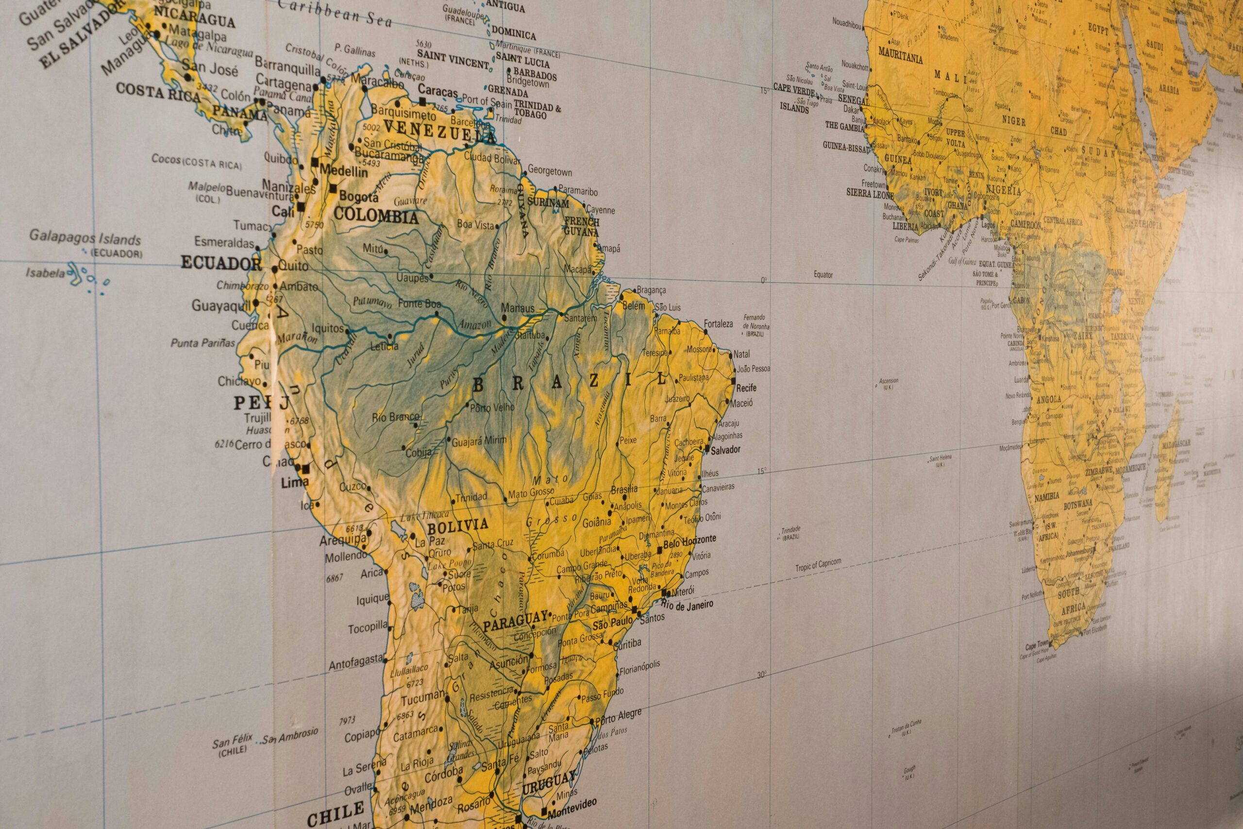 Close-up of a vintage-style map highlighting South America and parts of Africa.
